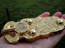 Belt buckle of gold found in the mounds