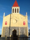 a church with shells all over the front