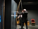 Bob tries the long bow at the Mary Rose Museum