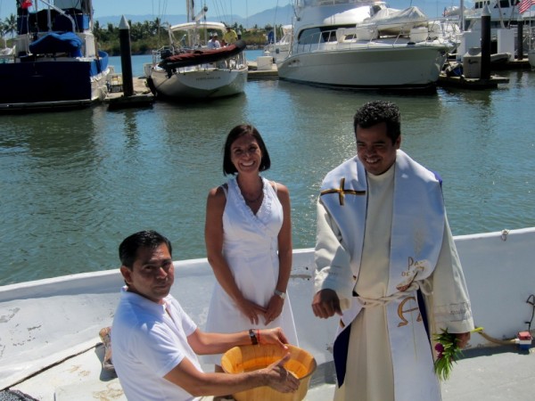 They get in a panga and bless each boat individually