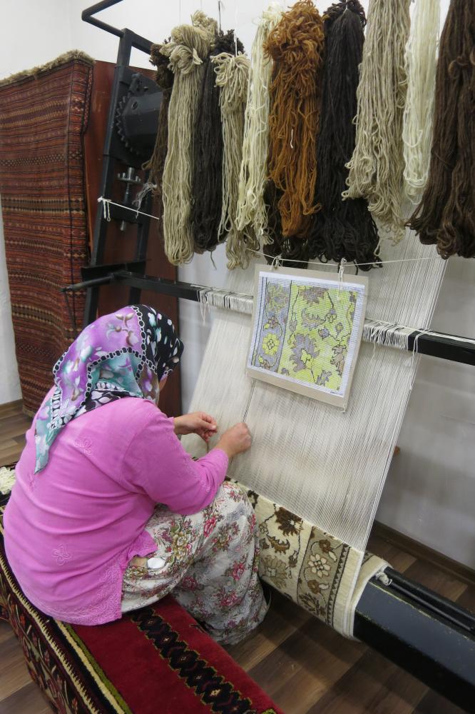 Turkish women weaving rugs