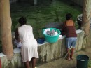 Upscale laundry in Livingston. There is a spring that keeps the inside of the laundry supplied with water. The ladies just bucket the water onto the cement washtubs.