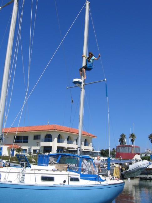 Lori going up the mast in preparation of pulling the Mizzen and Main.