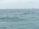 The Glasshouse Mountains with Bribie Island in the foreground