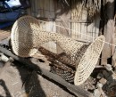 The entry tunnel of a Mainial fish trap. Made of woven bamboo strips it will be finished with the keg shaped outer body and bentwood stabilising frame. The frame is weighted with rocks when in use. 6/9/13