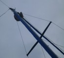 Nick up the mast re-running the spinnaker halyard after the disastrous first effort with the sail chute. It
