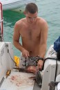 Owen cleaning the Gray Snapper he caught at the wreck in Green Turtle Cay.