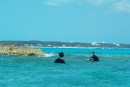 Guys snorkeling for lobster or fish.