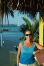 Me outside at the Tiki Hut with our boat in the background.