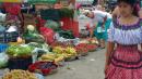 Another shot of the market: Alice gets into the picture showing all the fruits and vegetables