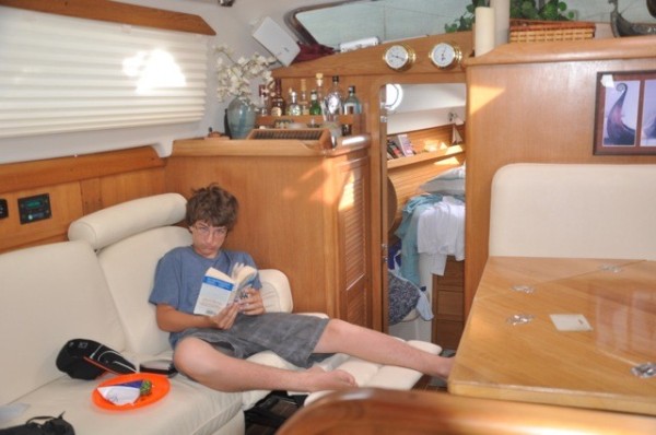 Gerrit reading on the boat, one of his favorite pastimes.