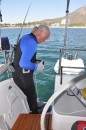 Eric putting on weight belt to dive the boat.
