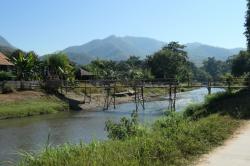 There are hundreds of bamboo bridges crossing rivers and streams in Thailand.  There are cheaply built and with occasional maintenance last a long time