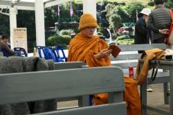 I always seem fascinated at the sight of Buddhist monks,  that I imagine as devout disciples of Buddha using modern phones and junk food.  Seems incongruent to my minds eye