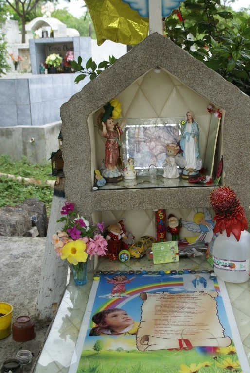 The parents of this 4 year old boys placed some of his toys at the head of his tomb