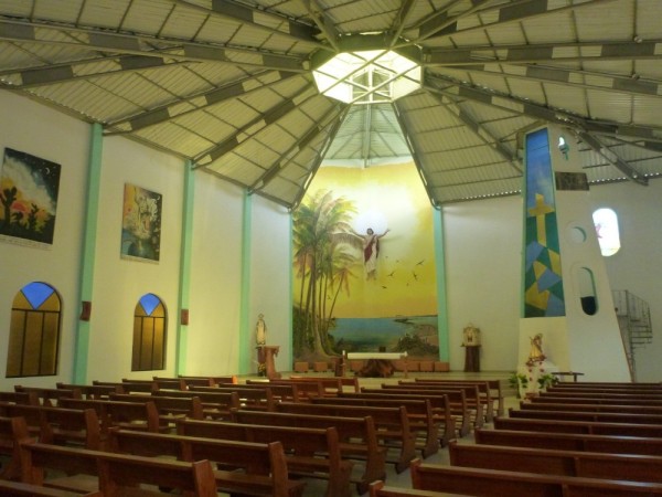 Inside the catholic church,  the main religion in the Galapagos.  Simple, tasteful, most of the statues are carved from wood by  local artists
