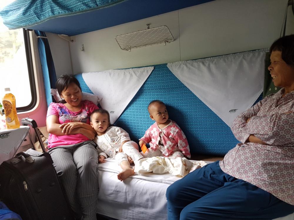 We then took a train to join out 5 day cruise up the Yantze River.  This is what they call a soft sleeper car,  4 berths in a cabin.  Our 6 hour ride was mid day so sharing the room with 3 other adults 2 children and an infant was not a problem.  We soon started sharing snacks and the kids enjoyed a few videos on Michelle