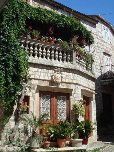 16th c. home with balcony garden terrace on cobbled street behind waterfront in Kut town