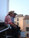 Gondoliers in traditional costume waiting for passengers