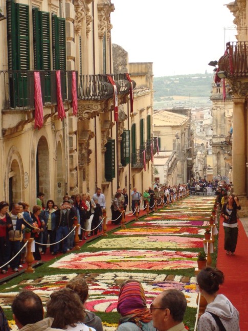 Looking down the Via Corrada Nicolaci with flower petal artwork lining the street