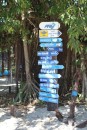 Sign post on Ilot Amedee to around the world.