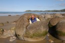Moreaki Boulders, Moreaki Beach, east coast of South Island.  These giant round boulders erode out of the dunes.  They are hollow inside and some have broken open, allowing our intrepid explorer inside for a look. These are found only on the east coast between Moreaki and Hampden. 