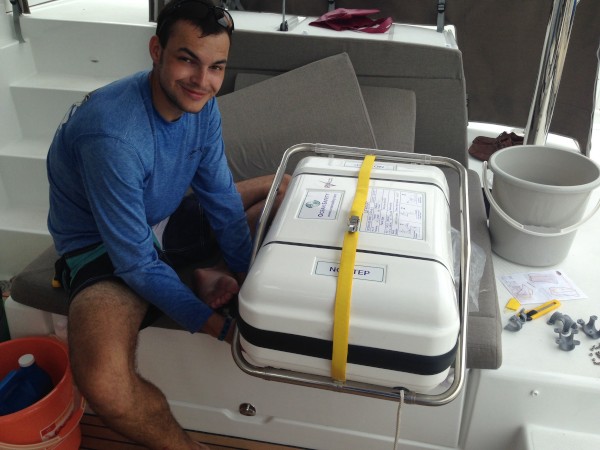 Axel installing the Ocean Safety life raft. This is an ISO Ocean series and one we hope never to use!