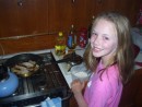 Hannah cooking grouper fingers at Farmers Cay
