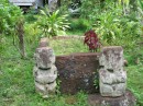 Grave site surrounded by tiki.
