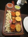 Typical Peruvian food - fish-k-bob with corn and potatoes and sauces.  Panchito restaurant. 