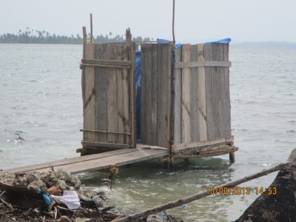 Self-cleaning commode over the sea.  As a result, they can not swim in the water at these populated islands.