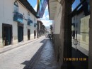 Side street in the historical center of Cusco, with the original Inca stones present as the base of the buildings.