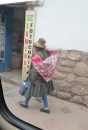 Quechua woman carrying goods.
