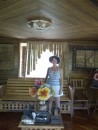 Gail inside the Coconut House where the flowers, blinds, wall art, lamp shade, chairs and tables were made from coconut tree wood, bark, leaves, etc.