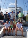 The crew on the foredeck with the car ship in the background.