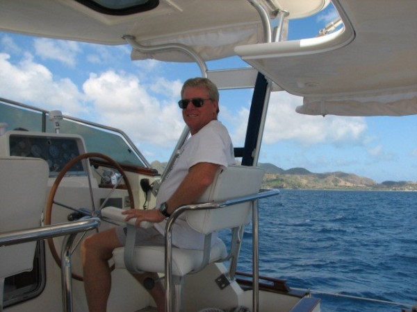 Tony at the helm sailing into Providencia.