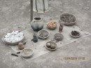 Several types of offerings including pottery, corn, fish, etc.