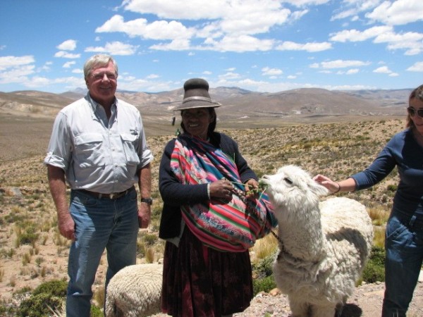 Tony with a shepherd and her alpaca.