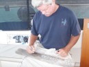 Ed engraving our driftwood for Boo Boo hill.