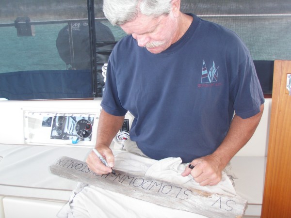 Ed engraving our driftwood for Boo Boo hill.