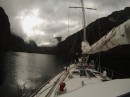 Cruising Broughton Arm off Thompson Sound, in the light of storm clouds