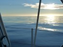 Land Ho! Crossing Cook Strait, the South Island appearing on the horizon just before sunset.
