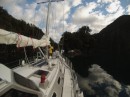 Coming in to tie alongside the mooring line in tiny Anchorage Cove, George Sound