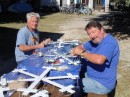 Meanwhile, Christmastime is rapidly approaching, and so Kevin (left) enlists Randy (right) to help him make giant snowflakes with which to decorate his trimaran for the St. Augustine Christmas Boat Parade. (Rivers Edge Marina, St. Augustine FL)