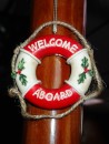 Welcome Aboard! We do not have a Christmas tree this year, but we do put up a few small decorations in honor of the season. This tiny life-ring wreath greets guests as they enter the galley-main salon area. (Radio Flyer Christmas décor, Rivers Edge Marina, St. Augustine, Florida)