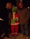Another Thursday evening brings another pot luck barbecue -- this time with a special guest. Here Laura (left) and Jim pose with -- you guessed it -- The Grinch. (Rivers Edge Marina, St. Augustine FL)