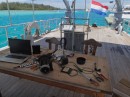 This dining/work table on the aft deck is the center of much of the activity that takes place on this converted ship. (Van Straelen, Marina ZarPar, Boca Chica, Dominican Republic.)  