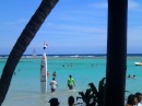 This surf board sticking up out of the water is a signpost for Isla Bonita, the Santo Domingo-Boca Chica Beach Club next door to Oceano. (Oceano, Boca Chica, Dominican Republic)