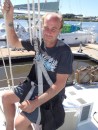 Preston, all settled in and ready to go up the mast, pauses briefly to pose for a photo. (Rivers Edge Marina, St. Augustine FL)