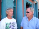 Jim strikes up a conversation with Michael (left) under the iconic Trade Winds sign. (Historic St. Augustine, FL)